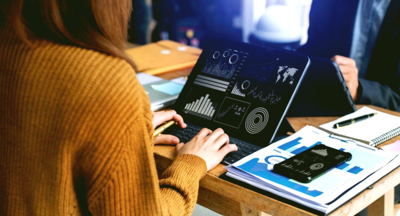 Investment professionals reviewing portfolio strategies together