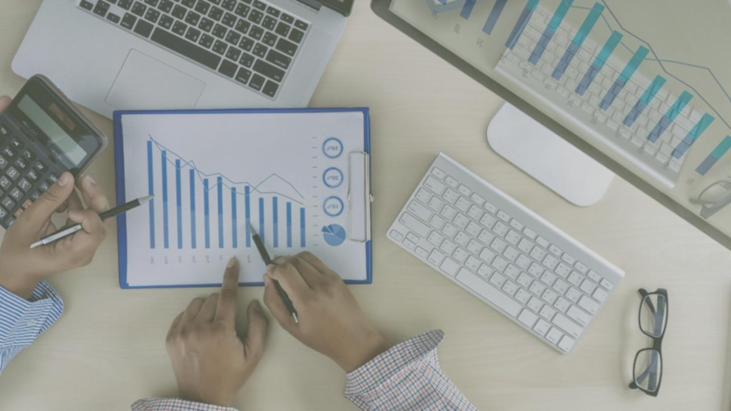 Investment community members collaborating on market analysis